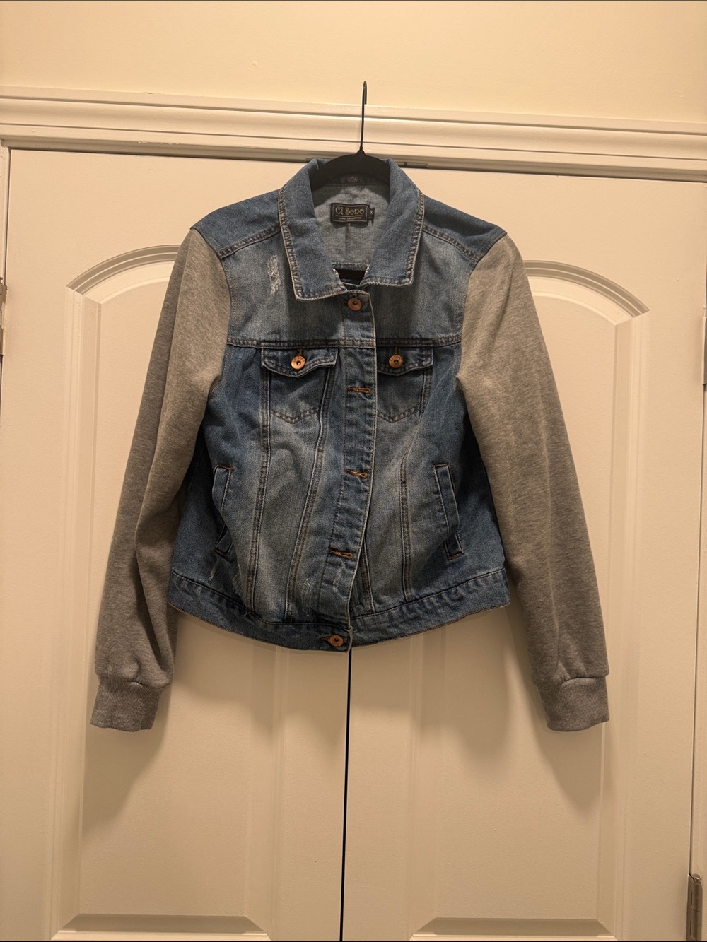 Jean jacket with grey jersey sleeves